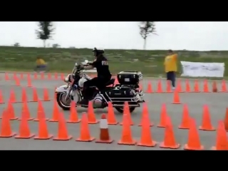 policeman taking motorcycle driving test